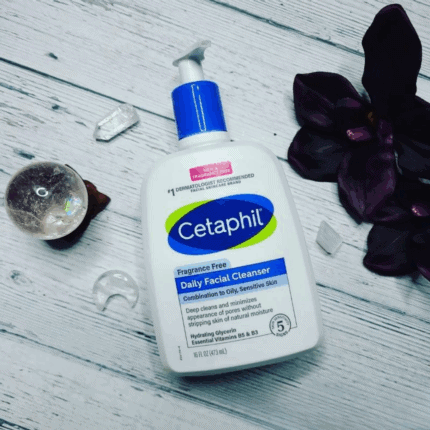 Cetaphil Daily Facial Cleanser bottle for combination to oily sensitive skin, fragrance free face wash with hydrating glycerin placed on wooden surface with decorative elements.