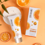 Dr Rashel Vitamin C Facial Cleanser tube with packaging box and orange slices, brightening and anti aging face wash with hyaluronic acid for glowing skin.