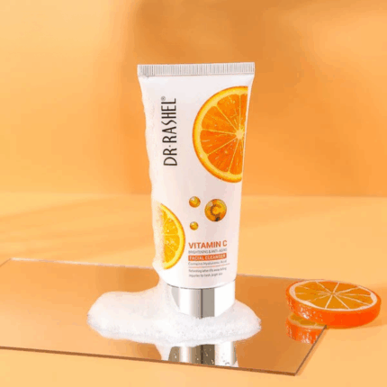 Dr Rashel Vitamin C Facial Cleanser tube with orange slices and foam, brightening and anti aging face wash with hyaluronic acid for fresh glowing skin.