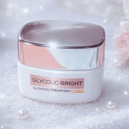 Glycolic-Bright Glowing Cream Day SPF 17 brightening moisturizer in a white jar with a reflective silver lid on a soft sparkling background with pearls.