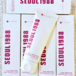 K-Secret Seoul 1988 Cream Snail Mucin 93% + Rice 100ml tube placed on top of multiple product boxes.