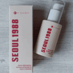 K-Secret Seoul 1988 Retinal Liposome 2% + Black Ginseng Serum 30ml bottle placed next to its box packaging on a light wooden surface.