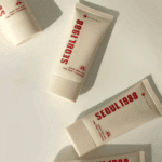 Multiple K-Secret Seoul 1988 Sun Pine Tree + Ceramide SPF50+ 50ml sunscreen tubes arranged on a light surface.