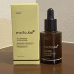 Medicube Glutathione Glow Serum 30g bottle with dropper next to product packaging box.