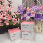 Medicube PDRN Pink Collagen Capsule Cream product boxes displayed with decorative flowers.