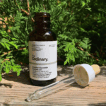 The Ordinary Ascorbyl Glucoside Solution 12% 30ml vitamin C serum bottle with dropper on wooden surface outdoors